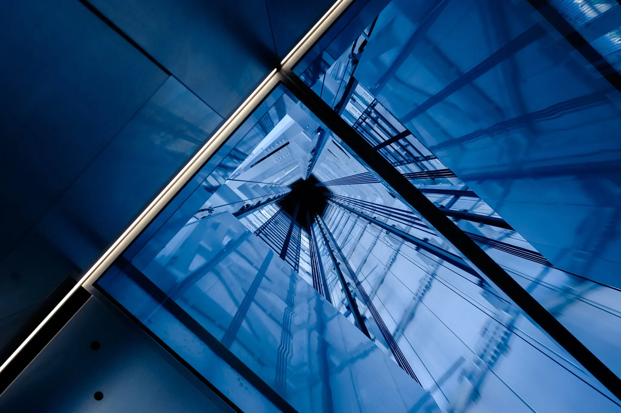 A blue building with a clock on top of it.